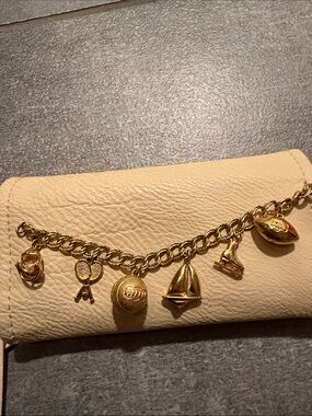 Monet Sports Theme Gold Tone Charm Bracelet Tennis Golf Skating 7 Charms